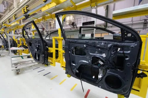 car door on conveyor. Robotic equipment makes Assembly of car. Modern car Assembly at factory